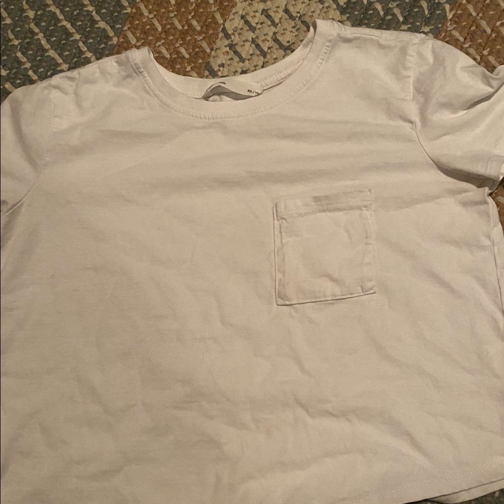 White tee with a pocket